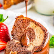 Triple Chocolate Bundt Cake - A rich, dense, and decadent chocolate cake that's filled with an airier chocolate cheesecake and topped with smooth chocolate ganache is a chocoholics DREAM! A celebration cake that's perfect for Valentine's Day, Christmas parties, or special anniversaries and birthdays that's sure to receive RAVE REVIEWS!