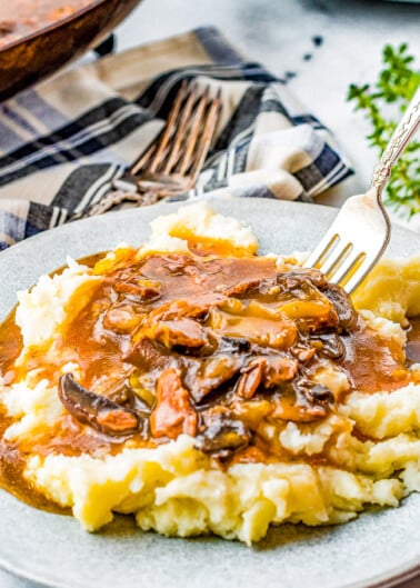 Instant Pot Beef Tips - Tender juicy beef tips smothered in loads of savory mushroom gravy! So much hearty flavor and just PERFECT for piling over mashed potatoes or noodles! An EASY family-favorite comfort food recipe made entirely in your Instant Pot in about 30 minutes!