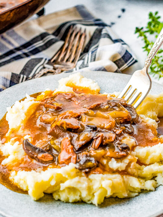 Instant Pot Beef Tips - Tender juicy beef tips smothered in loads of savory mushroom gravy! So much hearty flavor and just PERFECT for piling over mashed potatoes or noodles! An EASY family-favorite comfort food recipe made entirely in your Instant Pot in about 30 minutes!
