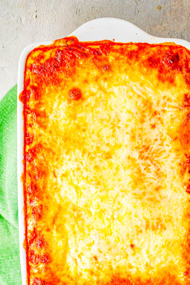 Best Homemade Lasagna - Made with Italian sausage, ground beef, three kinds of cheeses, and plenty of herbs and spices for the BEST homemade lasagna that your friends and family will LOVE! Easier than you think to make and everything is spelled out in detail for lasagna-at-home that tastes like it's from a fancy Italian restaurant!