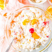 Ambrosia Salad - This classic fruit salad is made with pineapple, mandarin oranges, grapes, coconut, and tossed in a light and creamy, tangy-yet-sweet dressing! The EASIEST side dish ever - just add everything to one bowl and stir! A family favorite side dish that's always PERFECT for holidays, events, and parties! 