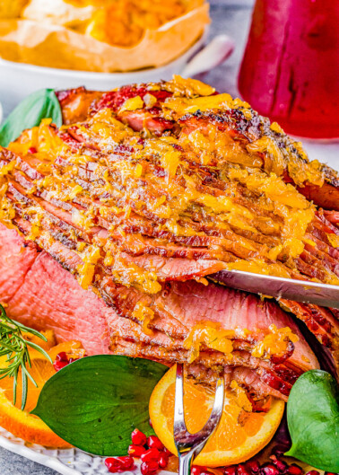 Orange Pineapple Glazed Ham - When you're looking for a holiday ham or family celebration ham recipe, look no further than this one! This orange pineapple ham is so juicy and moist thanks to a dry spice rub made with brown sugar and citrus and then the most delectable orange pineapple glaze! It caramelizes to sweet perfection making this ham a family favorite that pairs well with any side dish! 