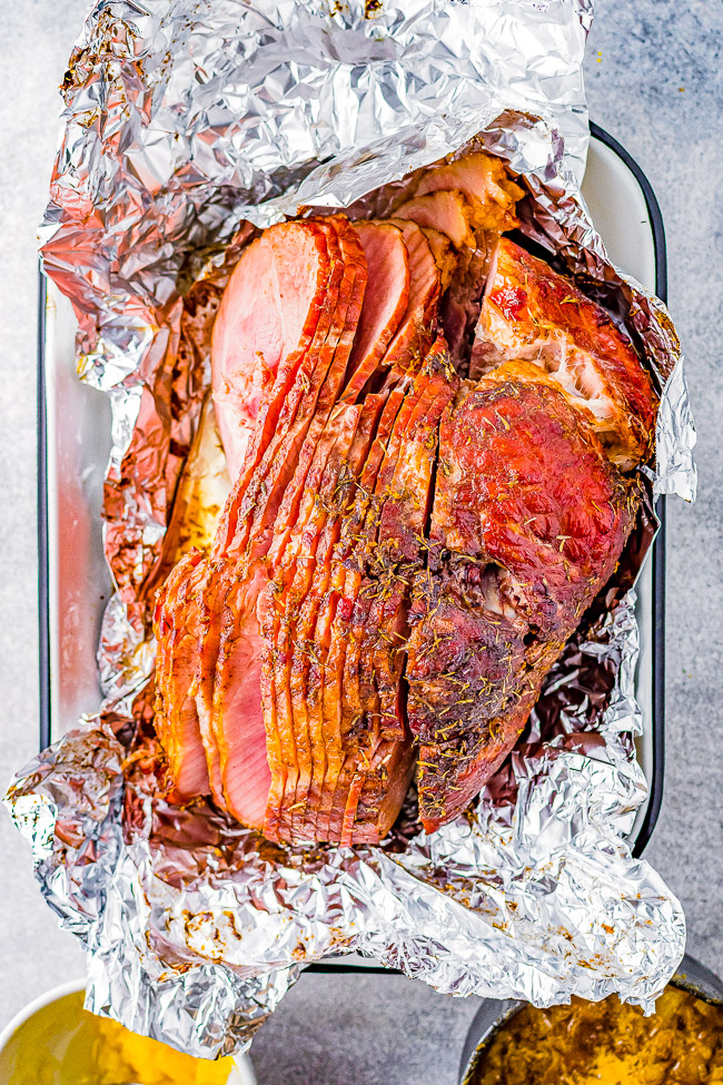 Orange Pineapple Glazed Ham - When you're looking for a holiday ham or family celebration ham recipe, look no further than this one! This orange pineapple ham is so juicy and moist thanks to a dry spice rub made with brown sugar and citrus and then the most delectable orange pineapple glaze! It caramelizes to sweet perfection making this ham a family favorite that pairs well with any side dish! 