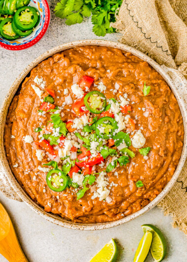 Instant Pot Refried Beans - Learn how to make perfect beans in your Instant Pot in a fraction of the time it takes on the stove or in a slow cooker. So much EASIER, FASTER, and more FLAVORFUL! Mash them up for the best refried beans you can ask for! So versatile and can be used in a ton of other recipes! 