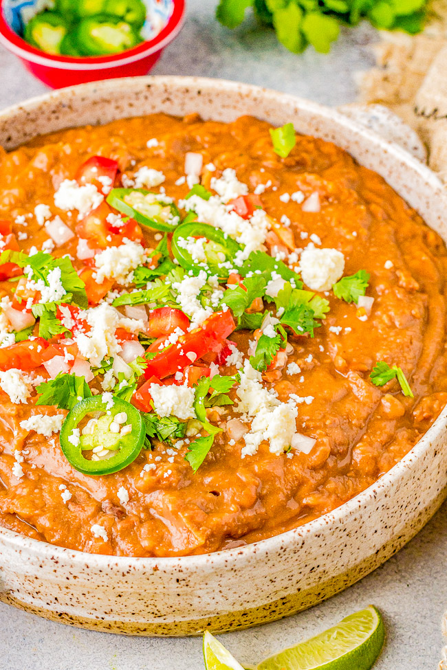 Instant Pot Refried Beans - Learn how to make perfect beans in your Instant Pot in a fraction of the time it takes on the stove or in a slow cooker. So much EASIER, FASTER, and more FLAVORFUL! Mash them up for the best refried beans you can ask for! So versatile and can be used in a ton of other recipes! 