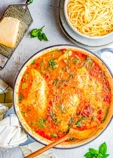 Creamy Tuscan Chicken - Tender, juicy chicken is simmered in a homemade sun dried tomato cream sauce for a family FAVORITE dinner! Between the fresh herbs, white wine, Parmesan cheese, and heavy cream this is a comfort food Italian classic that everyone LOVES! Made in just ONE SKILLET and ready in 45 minutes! 
