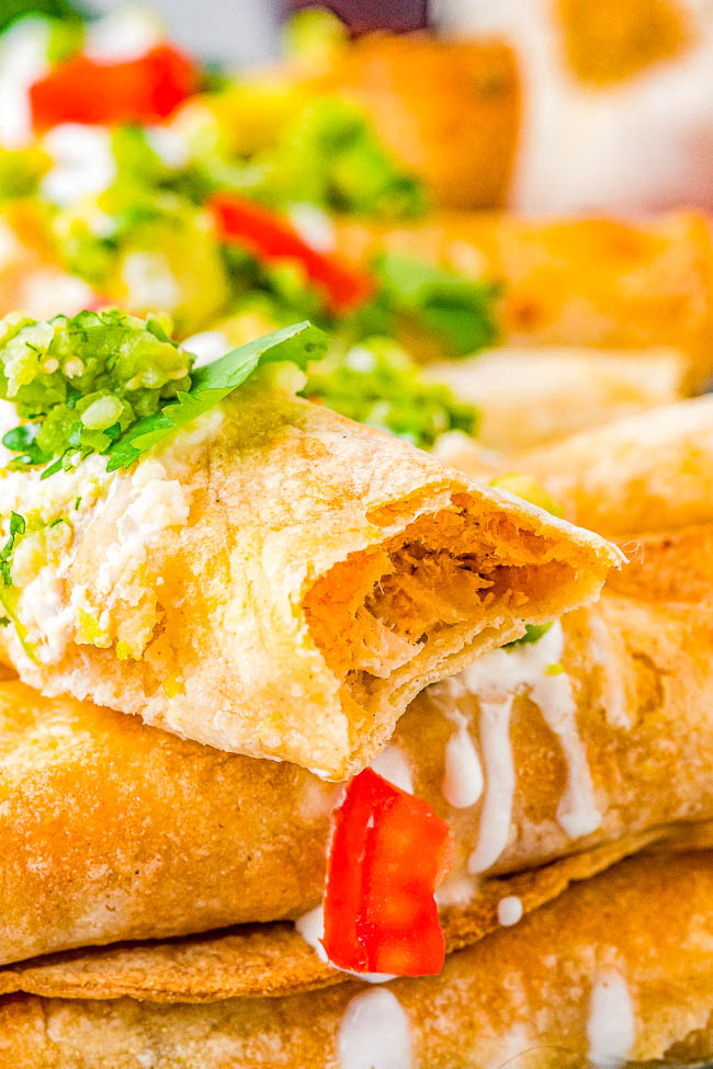 Air Fryer Chicken Taquitos - All the flavor of the chicken taquitos in your favorite Mexican restaurant, but healthier because these are air fried! Crispy and crunchy on the outside with a perfectly spicy chicken, cheese, and cream cheese filling mixture that just melts in your mouth! EASY, ready in 20 minutes, and the whole family will want seconds! 