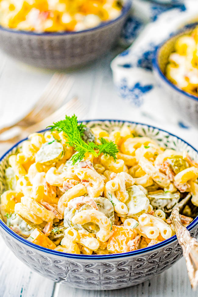Dill Pickle Pasta Salad - Calling all pickle fans, you're going to love this creamy pasta salad with crunchy dill pickles in every bite! Along with cubes of cheese and crumbled bacon, this pasta salad will be the star of your next picnic, potluck, barbecue, or summer holiday! FAST, EASY, and IRRESISTIBLE! 