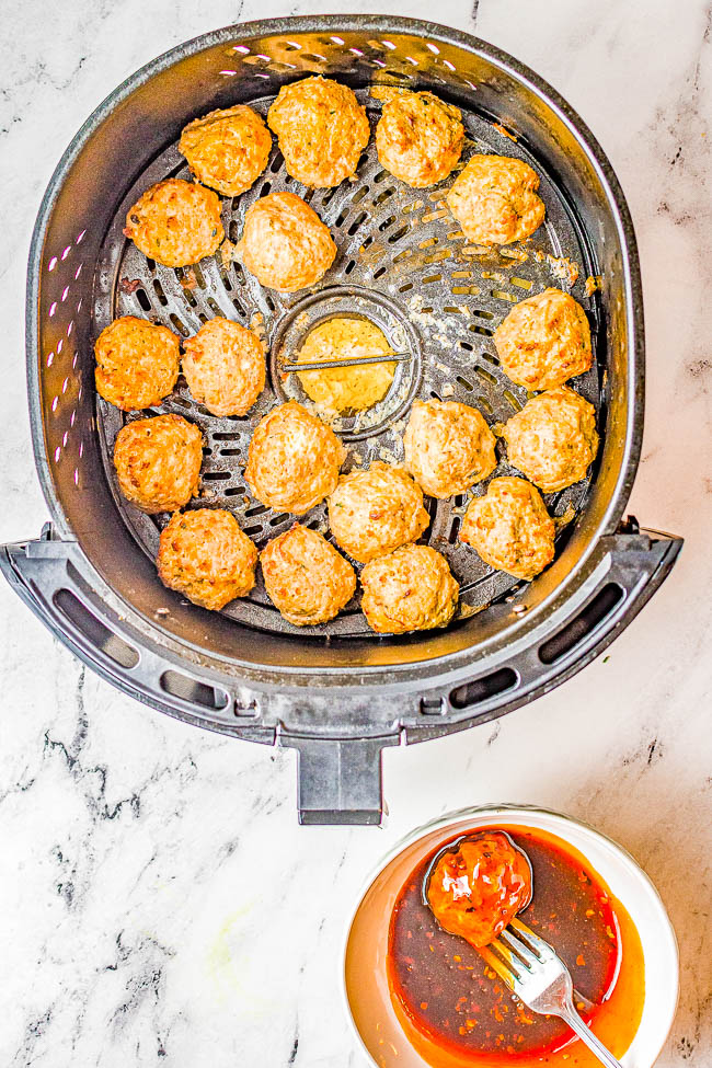 Air Fryer Firecracker Chicken Meatballs - Lightly crisped on the outside, juicy and tender on the inside, these homemade meatballs are air fried and then coated in a sweet-with-tangy-heat firecracker sauce with the perfect amount of heat! Serve these as an appetizer or as the main course. They're perfect for parties and events, too! Oven baking instructions provided as well as for how to make them using frozen meatballs.