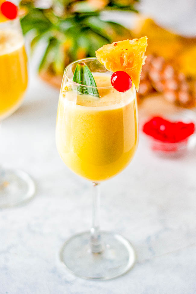 Easy Piña Colada - Learn how to make cool, creamy, refreshing, frozen piña coladas that will make you feel like you're poolside on a fancy tropical vacation! Blender and hand-shaken options provided. And don't worry, you can make these virgin, too. 