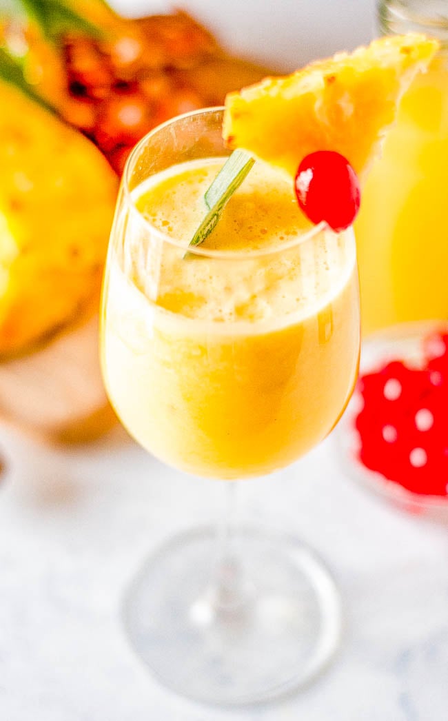 Easy Piña Colada - Learn how to make cool, creamy, refreshing, frozen piña coladas that will make you feel like you're poolside on a fancy tropical vacation! Blender and hand-shaken options provided. And don't worry, you can make these virgin, too. 