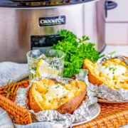 Slow Cooker Baked Potatoes - Learn how to make soft, fluffy, tender potatoes with super delicious skin in your slow cooker! Use this method when you want to free up oven space for a holiday meal or when you don't want to turn your oven on and heat up your house. Foolproof, perfect potatoes every time! 