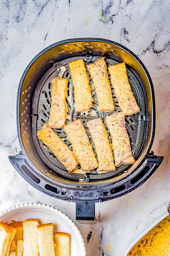 Air Fryer Cinnamon French Toast Sticks - A FAST and EASY recipe for French toast sticks made in the air fryer. Lightly crisped on the outside, tender on the inside, and spiced with plenty of cinnamon to make you reach for just one more! Perfect for breakfast on the go, weekend brunches, or as tasty snack! 