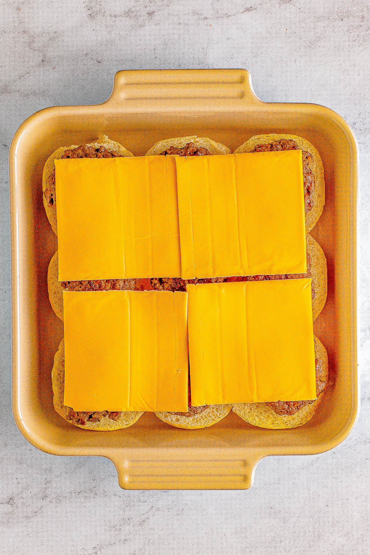 Big Mac Sliders - For anyone who likes the restaurant version, you're going to LOVE this homemade big mac copycat recipe in handheld slider form! Complete with a COPYCAT big mac special sauce, melted cheese, pickles, and tender beef all nestled between soft buttery buns. These EASY sandwiches are a family favorite FAST dinner recipe or make them for events, holidays, or game day parties!