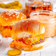Big Mac Sliders - For anyone who likes the restaurant version, you're going to LOVE this homemade big mac copycat recipe in handheld slider form! Complete with a COPYCAT big mac special sauce, melted cheese, pickles, and tender beef all nestled between soft buttery buns. These EASY sandwiches are a family favorite FAST dinner recipe or make them for events, holidays, or game day parties!