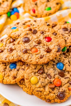 Monster Cookies - My recipe for classic monster cookies that are chock full of creamy peanut butter, oats, chocolate chips, and M&M's makes both kids and adults reach for just one more cookie! Fast, EASY, soft, perfectly chewy, and they'll become a family FAVORITE in no time! 