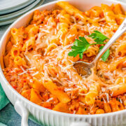 Pasta e Fagioli al Forno - Learn how to make this classic, Italian, comfort-food pasta recipe at home in just one hour! Chock full of juicy Italian sausage, tender penne pasta and cannellini beans, and a rich homemade red sauce with fabulous depth of flavor! Plus there are three types of cheeses used in this family-favorite recipe everyone will be begging you to make again! 