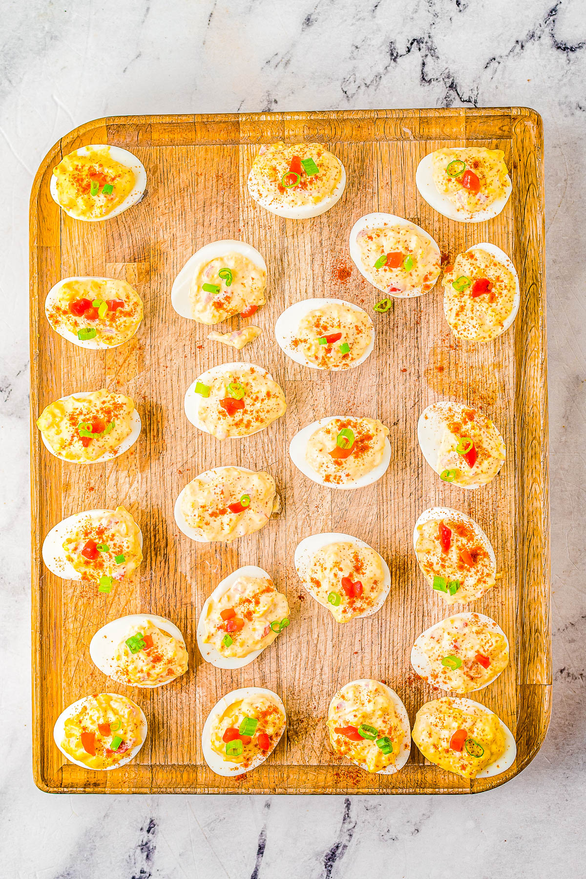 Pimento Cheese Deviled Eggs - A FAST and EASY recipe for the BEST deviled eggs because they're creamy, cheesy, and spiked with pimentos! Whether you're making them for a holiday party, game day or tailgating event, these are sure to be a crowd FAVORITE!