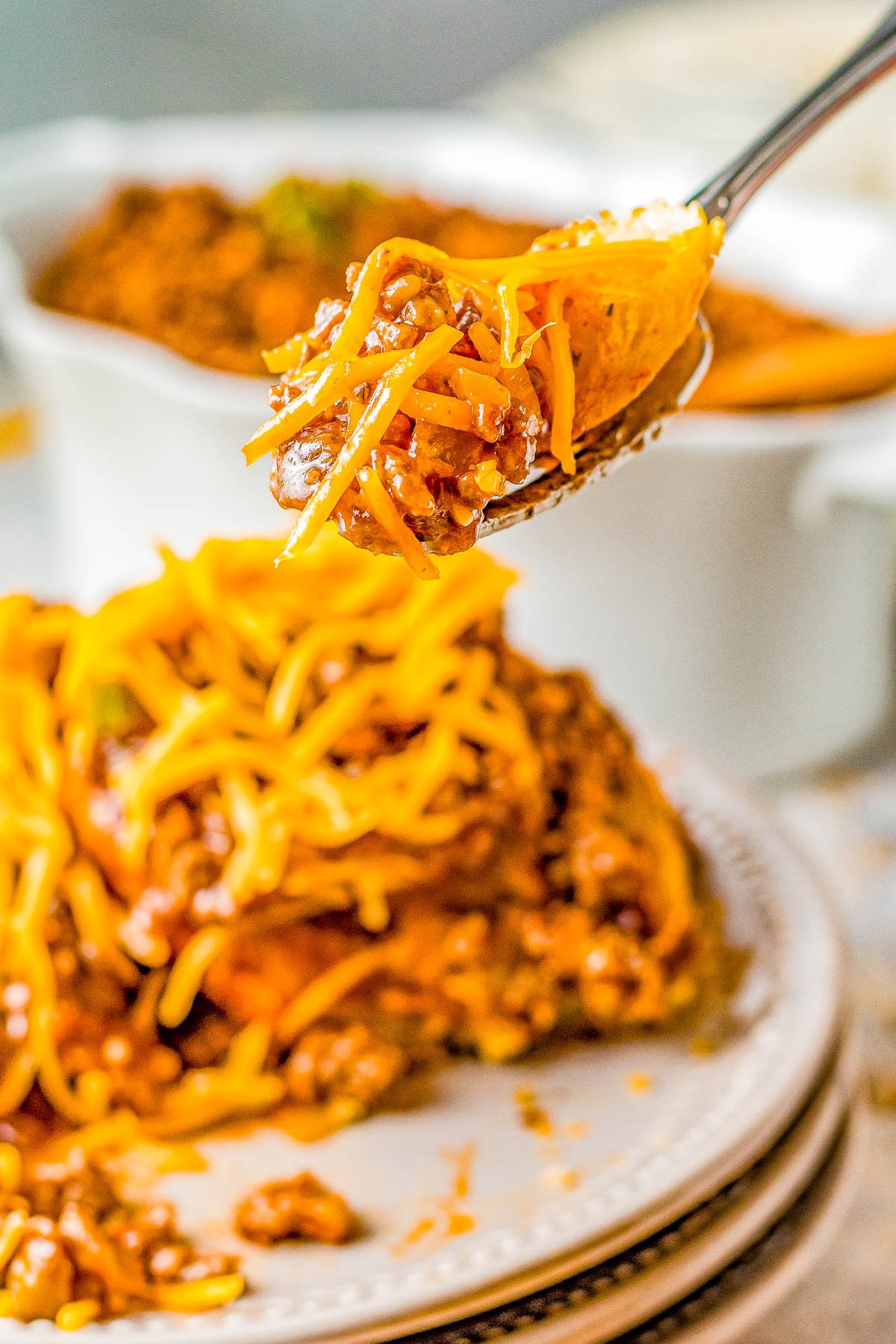 Slow Cooker Cheesy Sloppy Joes - Homemade sloppy Joes just got even better because they're cheesy!The perfect combination of sweet, tangy, optional spiciness, and so juicy! Whether you want to prep them before work for an easy weeknight dinner that's waiting, serve them at a summer holiday party, or for tailgating or a game day event, they're a classic family FAVORITE recipe and so EASY! Stovetop directions also provided.