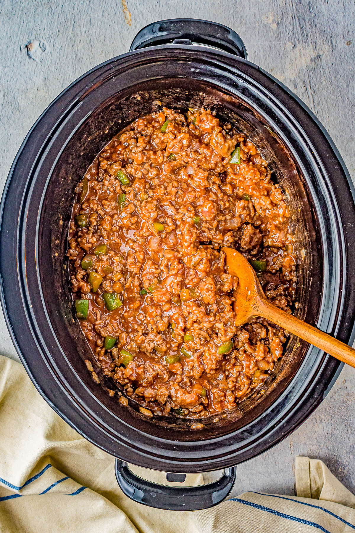 Slow Cooker Cheesy Sloppy Joes - Homemade sloppy Joes just got even better beuase they're cheesy! The perfect combination of sweet, tangy, optional spiciness, and so juicy! Whether you want to prep them before work for an easy weeknight dinner that's waiting, serve them at a summer holiday party, or for tailgating or a game day event, they're a classic family FAVORITE recipe and so EASY! Stovetop directions also provided.