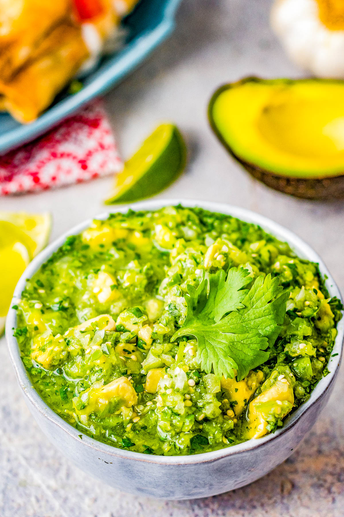 Chunky Tomatillo Avocado Salsa - If you like salsa verde you're going to LOVE this homemade version that includes creamy chunks of avocado! As FAST and EASY and tossing a handful of healthy ingredients into your food processor and the salsa is ready in seconds. No roasting or charring necessary for AMAZING homemade salsa! 