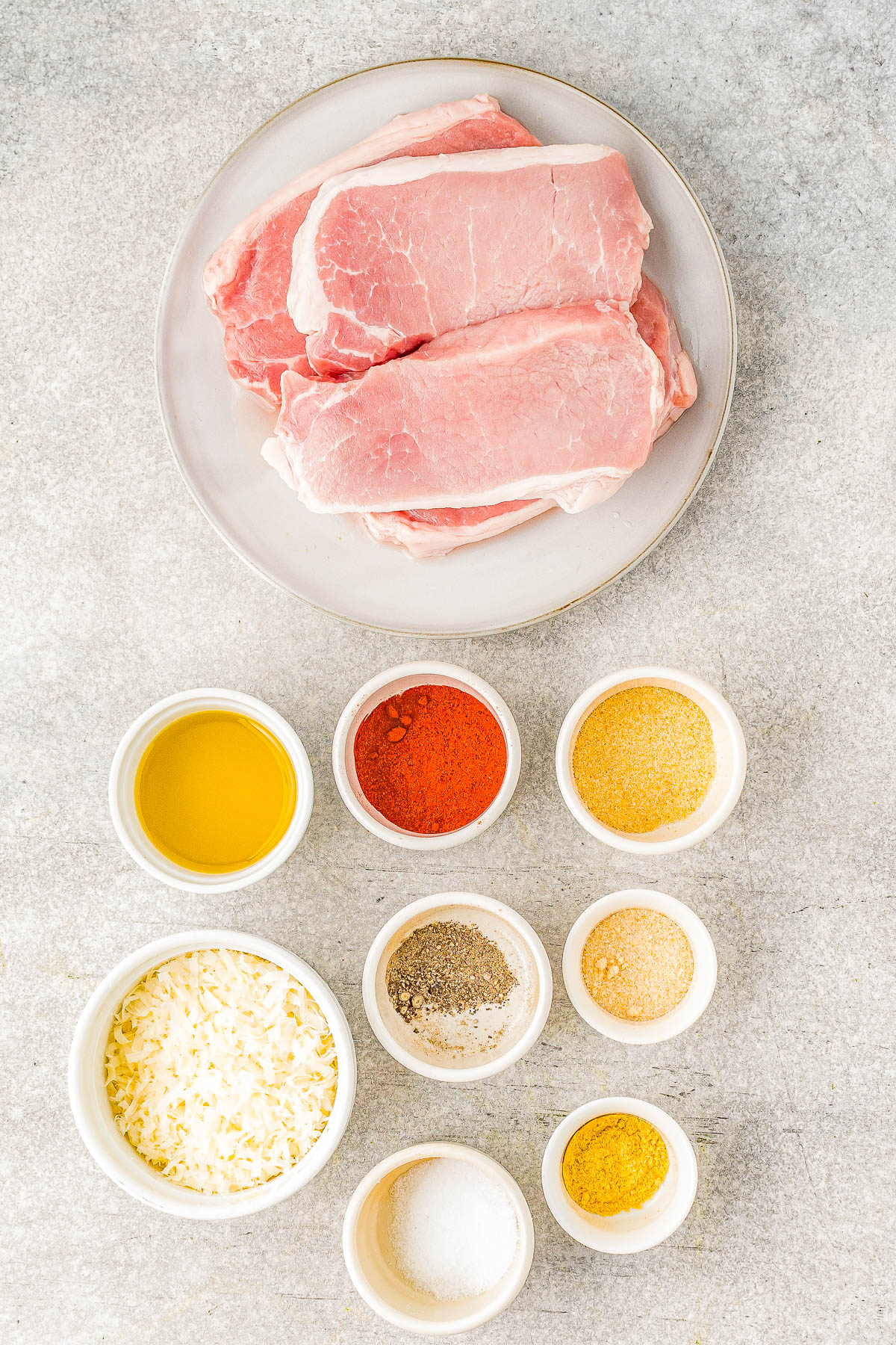 Air Fryer Pork Chops - Coated in Parmesan cheese and a rich spice rub, these air fried pork chops are perfectly crispy on the outside while staying tender and moist on the inside! They're EASY, ready in 15 minutes, perfect for busy weeknights, and a healthier way to enjoy "fried" food. Oven-baking and grilling instructions also provided.
