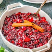 Cinnamon Apple Cranberry Sauce - Spice up your holiday celebrations with this scrumptious FAST and EASY homemade cranberry sauce that's made with cranberries, apples, apple cider, cinnamon sticks, and allspice for the PERFECT must-make side dish! A lovely balance of sweet-yet-tart with warmly spiced flavors so you'll never want to think about using store bought sauce again! 