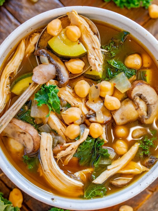 Chicken Vegetable Soup with Garbanzo Beans - Healthy yet hearty and ready in 30 minutes, this EASY chicken soup is perfect for chilly weather! Complete with juicy shredded chicken, mushrooms, tender garbanzo beans, zucchini and kale for a green pop in this noodle-free family favorite! 