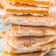 Churro Toffee - This Disneyland copycat recipe might be even more delicious than the real deal! Buttery, crunchy toffee is coated in sweet white chocolate that's dusted with a scrumptious combination of cinnamon and sugar for an irresistible churro flavor sensation! Just one bite of this homemade candy will make you feel like you're strolling right down Main Street!