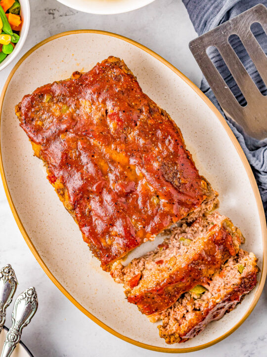 Cracker Barrel Meatloaf - This Cracker Barrel meatloaf copycat is tender, juicy, made with the restaurant's secret ingredients, glazed to tangy-sweet perfection, and sure to become a family FAVORITE comfort food dinner recipe! Air fryer AND oven baking options provided.