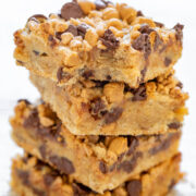 Peanut Butter Chocolate Chip Toffee Bars - Thick, rich, decadent cookie bars made with chocolate chips, peanut butter chips, creamy sweetened condensed milk, and crunchy toffee bits! A FAST and EASY no mixer, one bowl recipe that is sure to impress friends and family! The bars also keep fresh for a long time and are a great make-ahead dessert or great for gifting.
