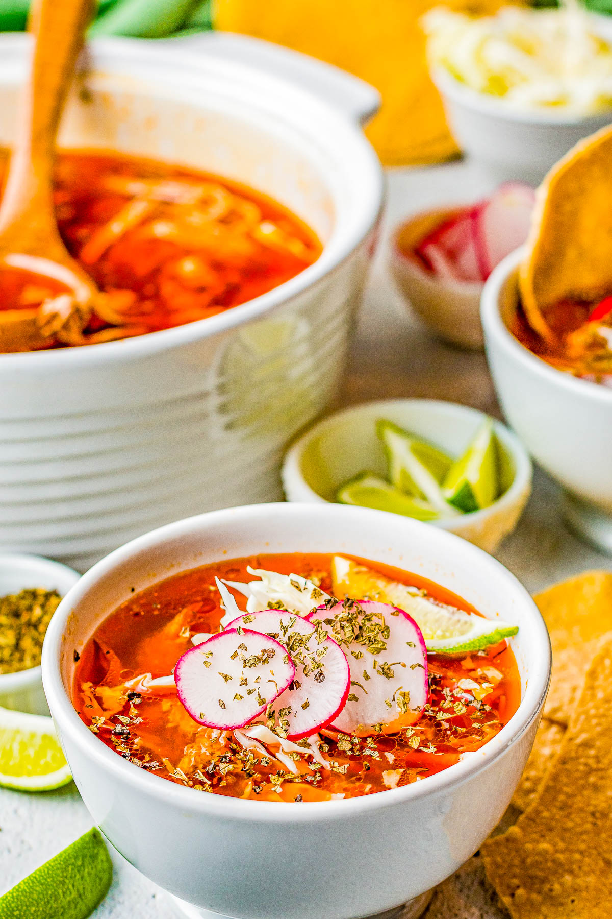 Pozole Rojo - This traditional Mexican soup features tender shredded pork, hominy, and more in a flavorful red chile broth! Learn how to make this authentic, rich and comforting, and very filling soup. It's perfect for chilly fall and winter nights! Easy to follow steps for either an INSTANT POT, SLOW COOKER, or STOVETOP! 