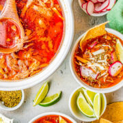 Pozole Rojo - This traditional Mexican soup features tender shredded pork, hominy, and more in a flavorful red chile broth! Learn how to make this authentic, rich and comforting, and very filling soup. It's perfect for chilly fall and winter nights! Easy to follow steps for either an INSTANT POT, SLOW COOKER, or STOVETOP! 