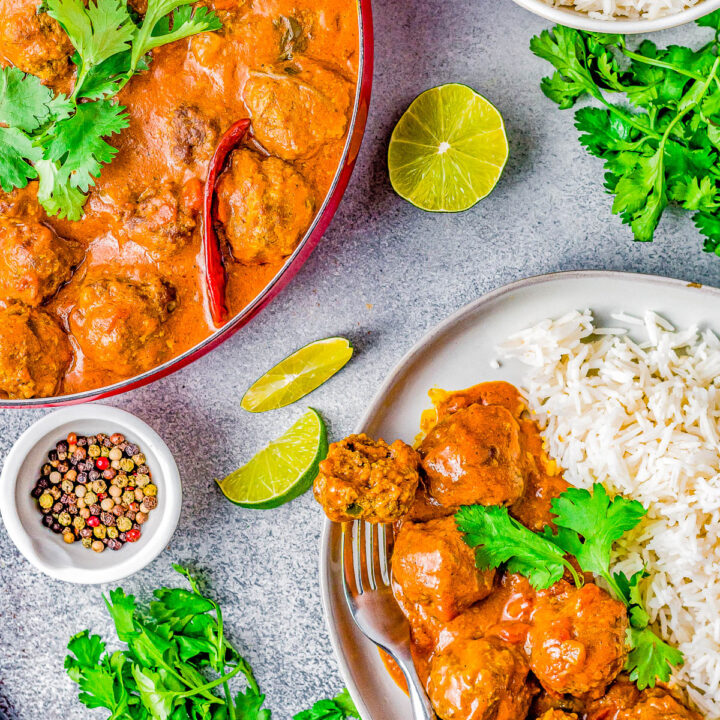 Red Curry Meatballs - Indian-spiced beef meatballs are simmered in a homemade red curry sauce that's perfectly spicy, savory, and so comforting especially when served over a bed of basmati rice! Learn how to recreate this ethnic dish that'll IMPRESS your family and friends and have everyone begging for more!