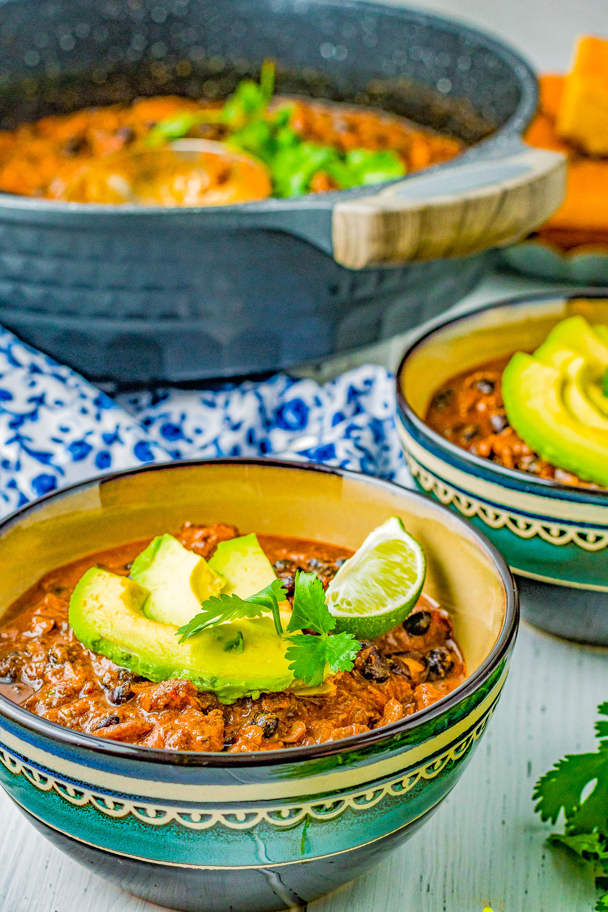 Triple Pork Black Bean Chili - Three types of pork including bacon, pork roast, and chorizo plus black beans and more in this comforting, hearty, and filling chili recipe! Easy and perfect for chilly weather, family dinners, or make it for game day or tailgating parties! 