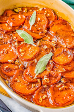 Candied Yams - Learn how to make the BEST candied yams which are baked in the most wonderful buttery cinnamon-and-sugar sauce! If you're looking for an EASY Thanksgiving or Christmas side dish recipe, look no further than this EASY holiday recipe with almost no active prep time. Truly candy-like in how sweet and wonderful they are. Sure to become a guaranteed family favorite!