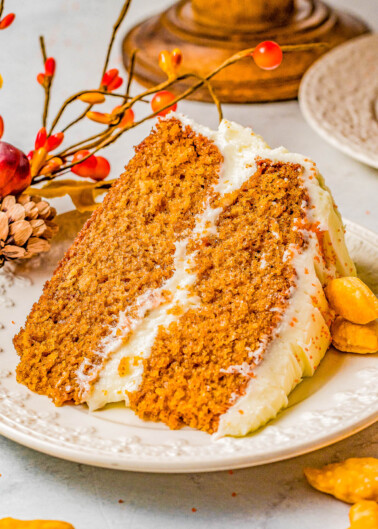 Spice Cake with Cream Cheese Frosting – Celebrate the cozy flavors of the fall and winter holiday season with this soft, moist, and richly spiced layer cake! Complete with scrumptious homemade cream cheese frosting, this classic spice cake is what holiday dessert dreams are made of! Serve it as your Thanksgiving or Christmas dessert centerpiece and your family will ask for it every year!