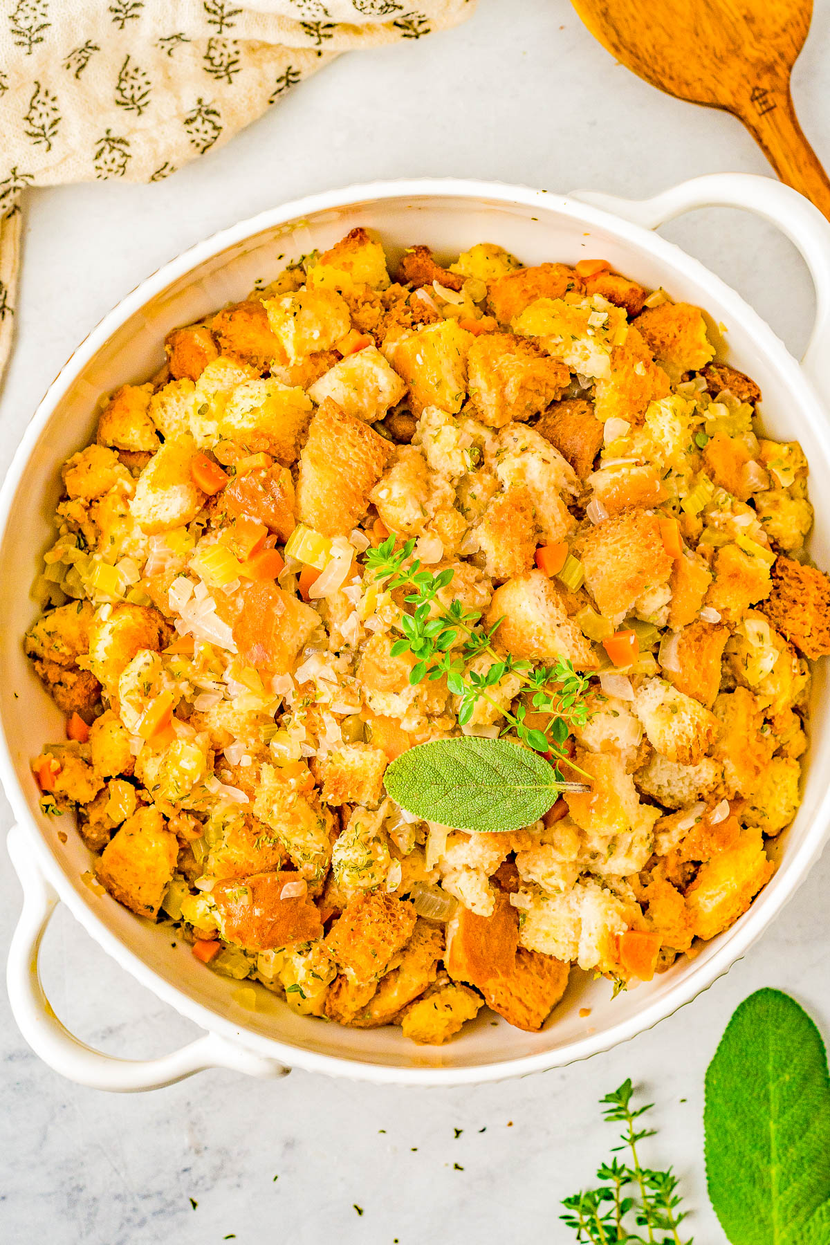 Stovetop Stuffing - With this easy homemade stuffing recipe, you'll never need a box of the store bought stuff again! Onions, carrots, and celery are sautéed in butter, seasoned with an aromatic bouquet of herbs, and cubed bread is stirred in to create the most perfect stuffing that's moist and tender! FAST, EASY, and guaranteed to become a Thanksgiving and Christmas family favorite!