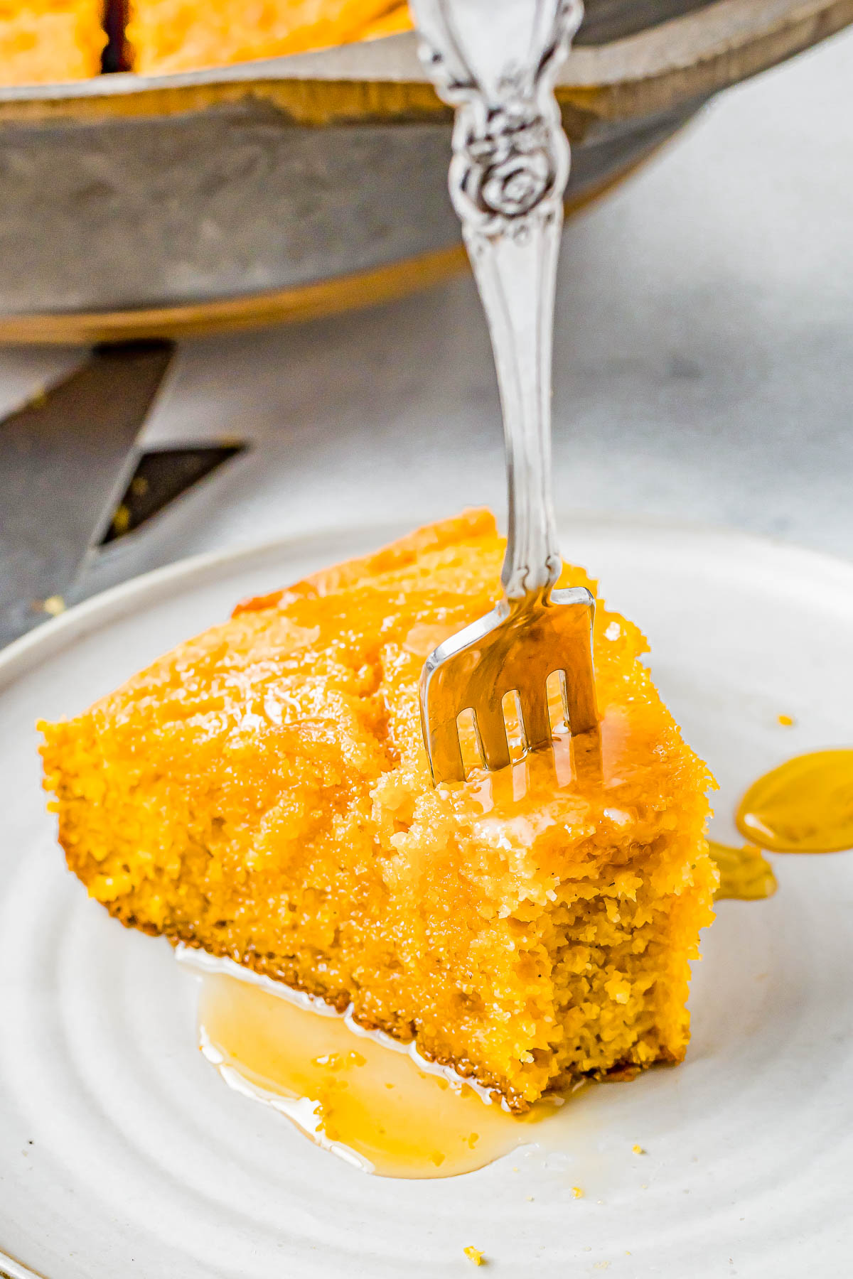 Sweet Potato Cornbread - Homemade cornbread just got better because it's jazzed up with mashed sweet potatoes, brown sugar, and pumpkin pie spice! Thanks to the natural moisture from sweet potatoes and the addition of buttermilk, it's so moist and flavorful! Whether you're looking for a fall-inspired comfort food recipe or a new Thanksgiving or Christmas side dish, this cornbread is EASY and will become a new family FAVORITE!