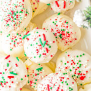 White Chocolate Peanut Butter Truffles - Fast, EASY, no-bake, and the BEST peanut butter truffles! A creamy peanut butter filling with a bit of texture from graham cracker crumbs, dipped in white chocolate (or milk or dark), and topped with sprinkles! Great MAKE-AHEAD homemade hostess gifts, for cookie exchanges, or set them out at Christmas parties.