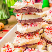 Peppermint Bark - An EASY, no-bake, and make-ahead recipe for homemade peppermint bark! This classic Christmas candy never goes out of style and is perfect for gifting, holiday parties, or cookie exchanges! No one can resist a piece of this festive looking and oh-so-pepperminty treat made with both semi-sweet and white chocolate, and crushed peppermints! 