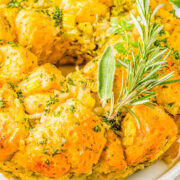 Pull Apart Stuffing Ring - You'll never guess the secret ingredient that not only makes this stuffing ring FAST and EASY, but also creates PERFECT texture! The stuffing is soft and tender, buttery and moist, not at all soggy, and seasoned to perfection with sage, thyme, rosemary, and parsley! A must-make side dish for Thanksgiving, Christmas, and holiday entertaining! 