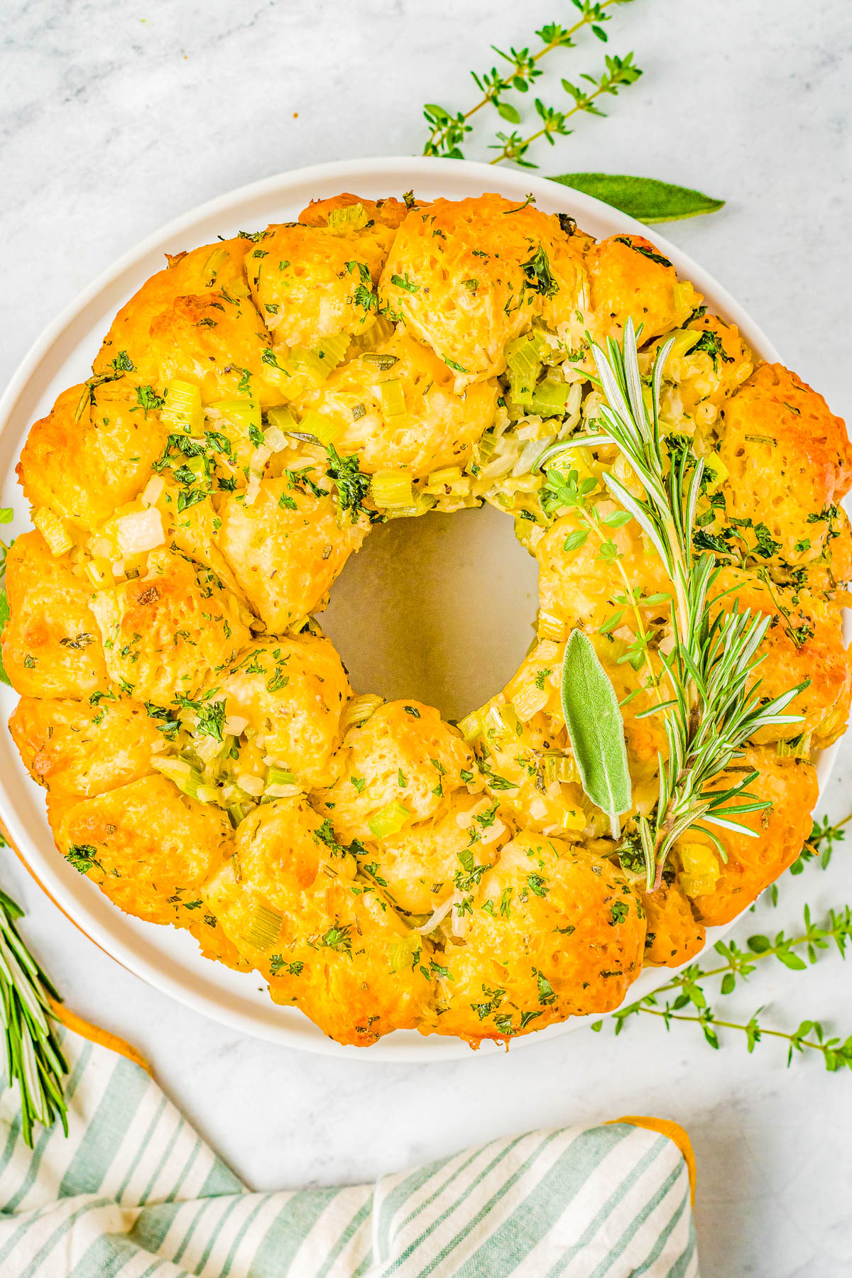 Pull Apart Stuffing Ring - You'll never guess the secret ingredient that not only makes this stuffing ring FAST and EASY, but also creates PERFECT texture! The stuffing is soft and tender, buttery and moist, not at all soggy, and seasoned to perfection with sage, thyme, rosemary, and parsley! A must-make side dish for Thanksgiving, Christmas, and holiday entertaining! 