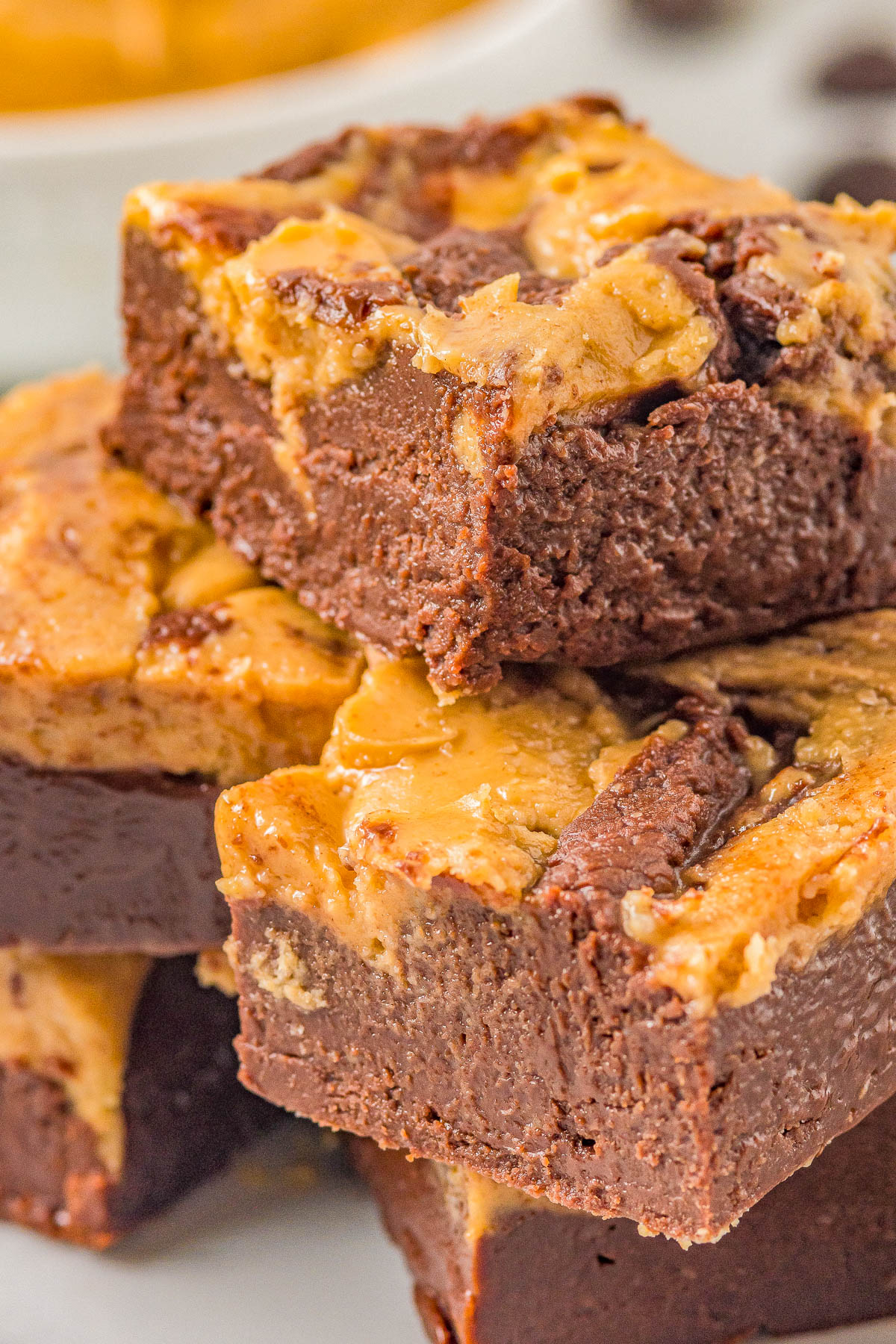 Chocolate Peanut Butter Fudge - Rich and decadent chocolate fudge adorned with peanut butter swirls! Made in the microwave with just SIX ingredients, there's no boiling or candy thermometers involved in this FAST and EASY recipe for PERFECT fudge every time! Make it in advance, it keeps for weeks, and it's great for gifting and holiday entertaining! 