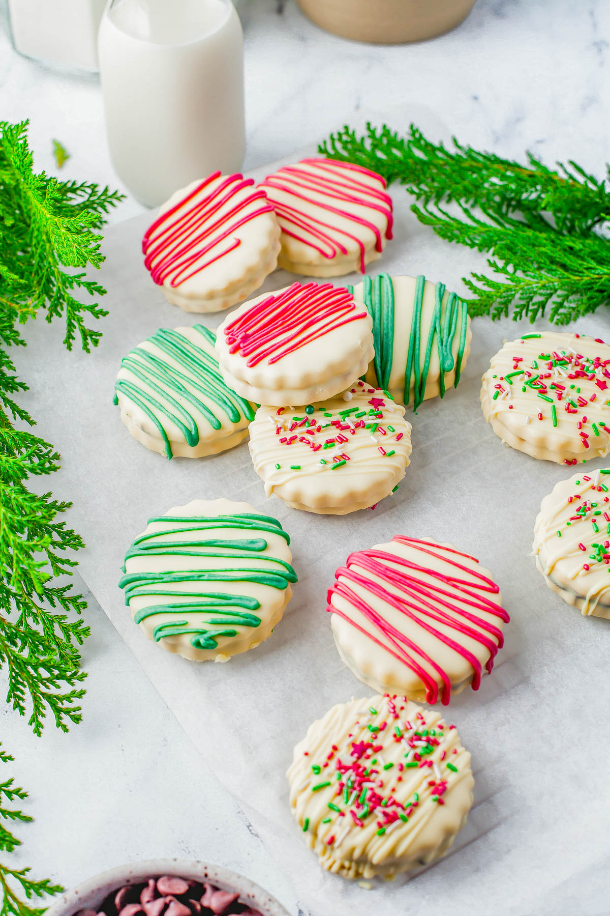 Shortbread Sandwich Cookies – Chocolate filling is sandwiched between two buttery shortbread cookies before the cookies are dipped in sweet white chocolate and festively decorated! EASY enough for novice bakers and PERFECT for holiday entertaining, gifting, and cookie exchanges!