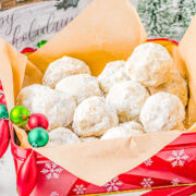 Snowball Cookies - They go by many names, but one thing for sure is that they're a holiday FAVORITE! Super buttery with a lightly crunchy interior from chopped nuts, and dusted with confectioners' sugar for a snowy look! These classic Christmas cookies just melt in your mouth and belong on your holiday baking list and are great for cookie exchanges! 