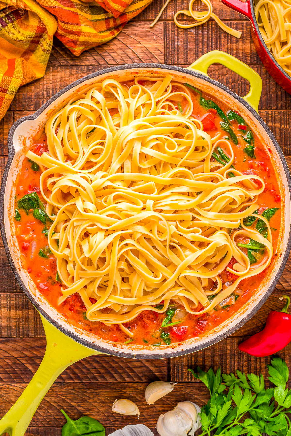Pasta with Vodka Sauce - Make an Italian restaurant-worthy pasta dish EASILY at home in 30 minutes! Pasta is tossed in a tomato-forward sauce that includes red pepper flakes, onions, garlic, spinach, heavy cream for RICHNESS and of course, vodka! A family FAVORITE comfort food classic recipe that's doable for busy weeknights, for entertaining, or for date night at home!