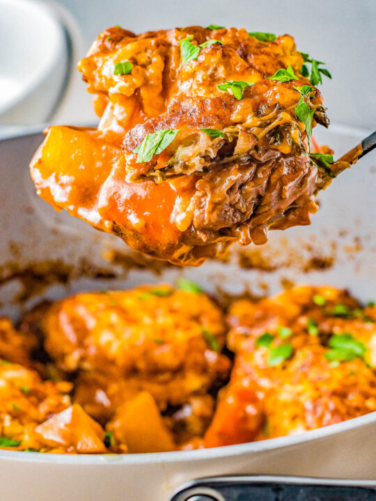 Beef Stew and Dumplings - Beef roast, potatoes, carrots, and more are simmered to tender PERFECTION in a rich and savory broth for the best beef stew that's easy to make! Cheesy dumplings on top are the final comfort food touch making this a classic family favorite recipe especially when the weather is chilly! 