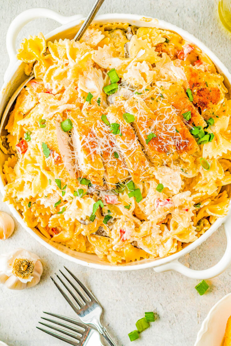 Creamy Cajun Chicken Pasta – Juicy Parmesan-crusted chicken and tender pasta with vegetables are tossed together in a creamy Cajun sauce making this recipe a family FAVORITE! My homemade version is a Chili’s Restaurant copycat but I assure you, this is a better-than-the-restaurant dish you’ll want to put on rotation even on busy weeknights!