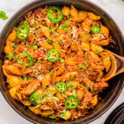 Chicken Chorizo Pasta - Tender pasta shells are mixed with chorizo and seasoned shredded chicken in a cream cheese and tomato based sauce for a truly FLAVORFUL comfort food dinner recipe! Ready in 45 minutes, EASY, and with just the right amount of heat to have everyone asking for seconds! 